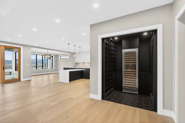 Wine room 2, new-build lake-view home in West Kelowna, BC. Real estate photography by Pixel Pro Productions.